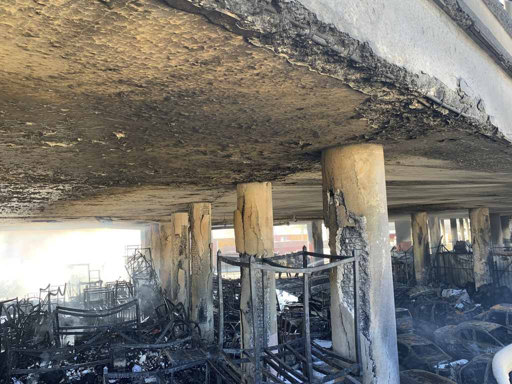 Damage of columns from an intense fire under Interstate 10 that severely damaged the overpass