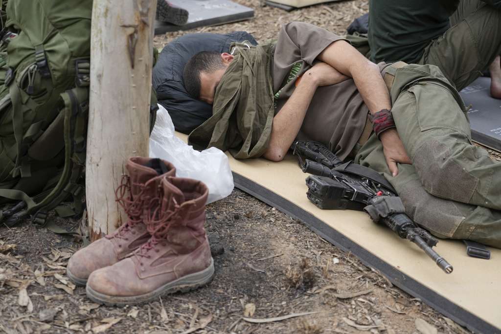 Rest is hard: An Israeli soldier rests near the Israel-Gaza border 