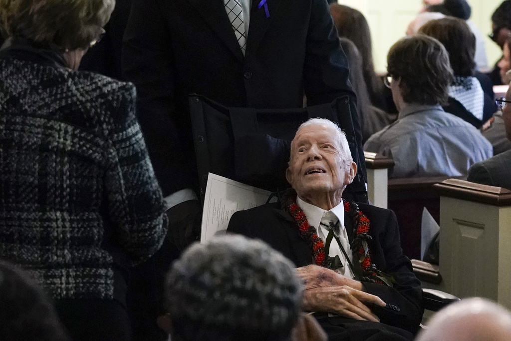 The former president, now 99 and in hospice care, sat in a wheelchair next to Maranatha