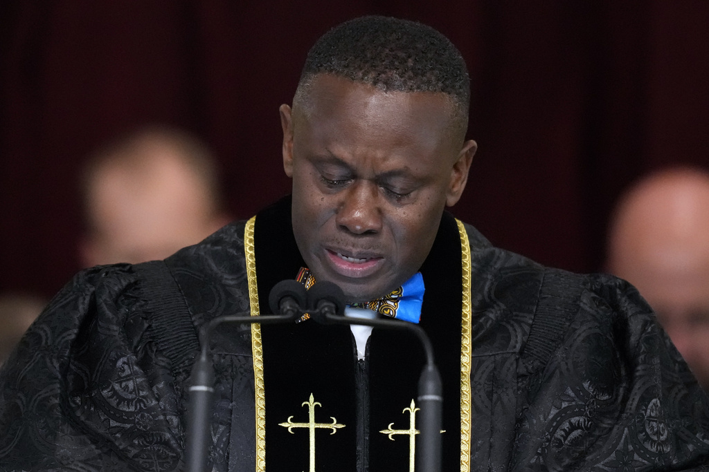 Pastor Tony Lowden cries during a prayer during the funeral service for former first lady Rosalynn Carter 