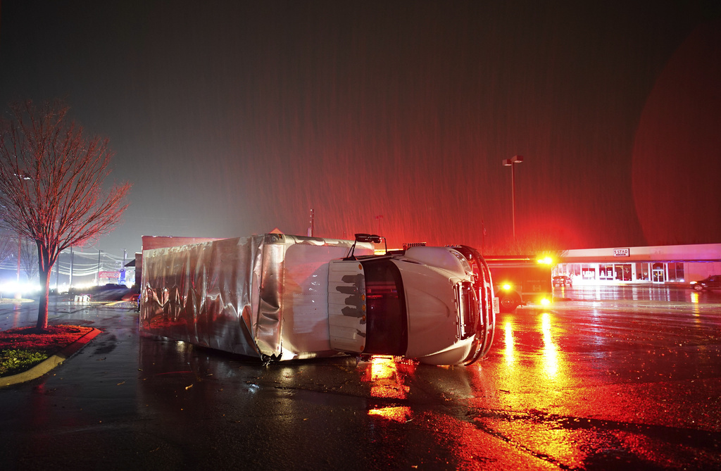 A semitrailer is overturned by an apparent tornado on West Main Street in Hendersonville, Tenn.