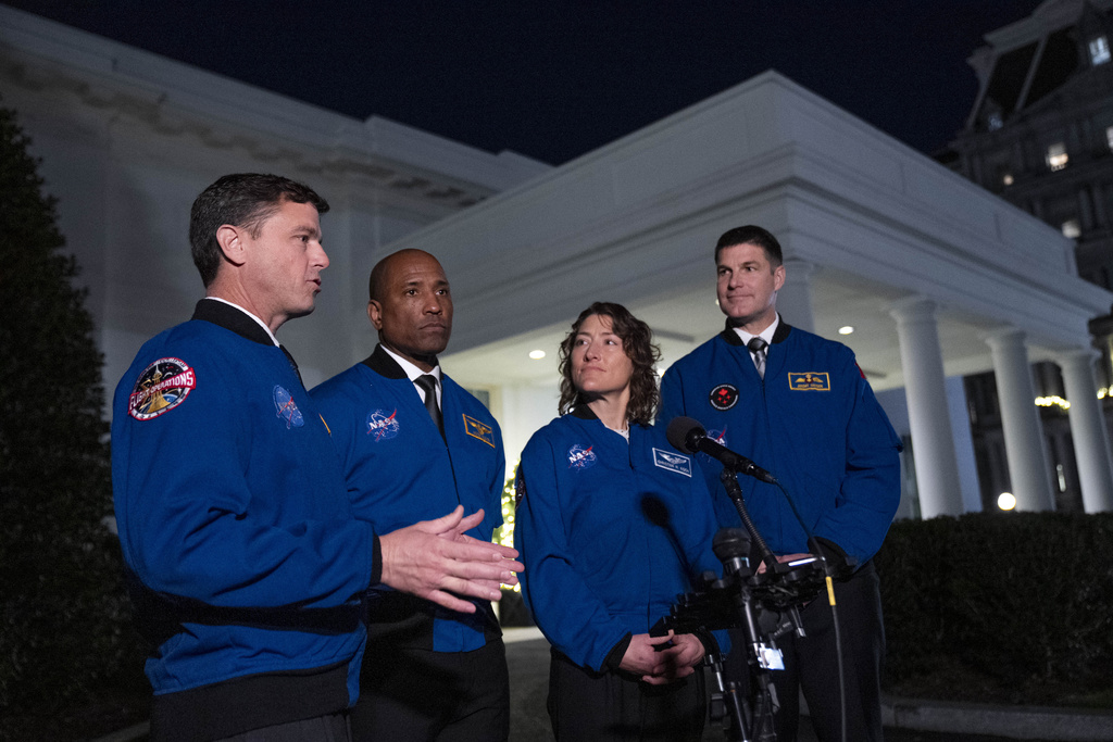 Artemis II crew members from left, Reid Wiseman, Victor Glover, Christina Hammock Koch, and Jeremy Hansen speak to members of the media outside the West Wing of the White House