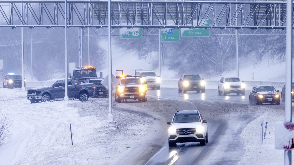 Omaha police and a tow truck respond to an accident on I480 in Omaha, Neb.