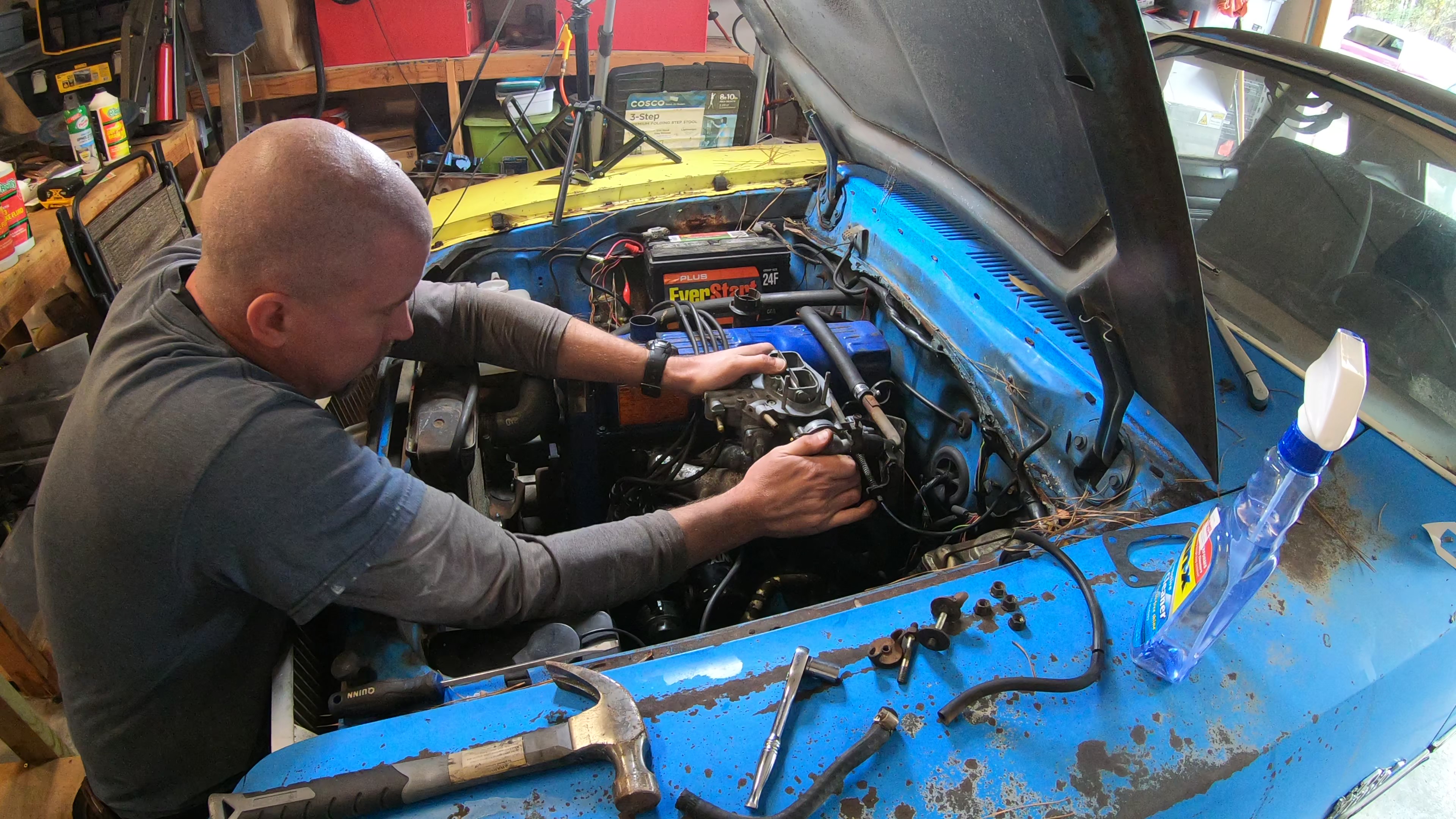 Pastor David Wheeler working on vehicle engine