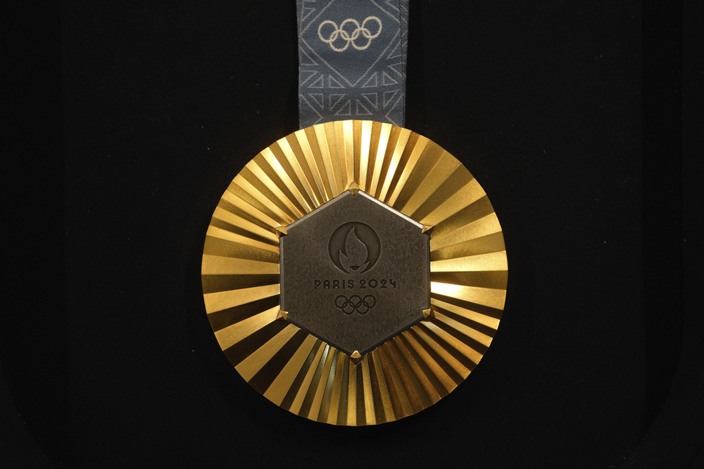 The Paris 2024 Olympic gold medal is presented to the press