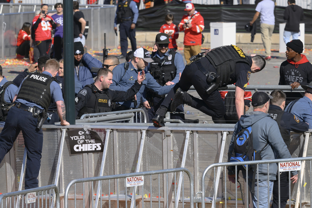 Law enforcement personnel clear the area around Union Station following a shooting at the Kansas City Chiefs NFL football Super Bowl celebration