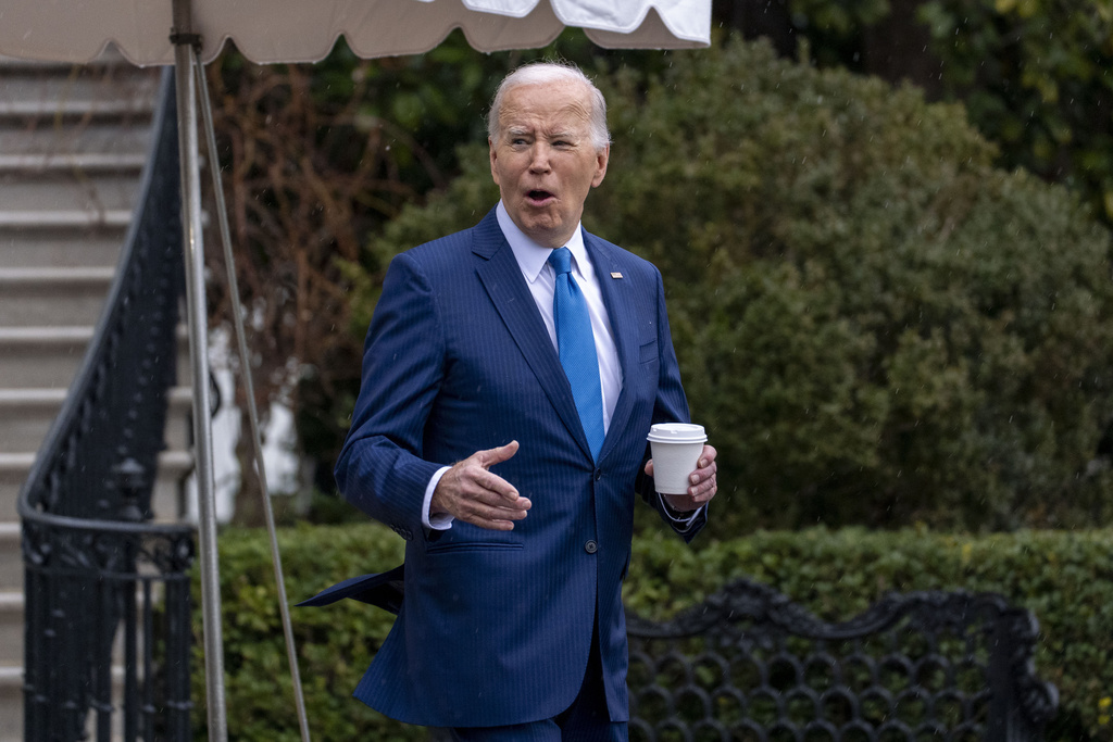 President Joe Biden walks out of the White House 