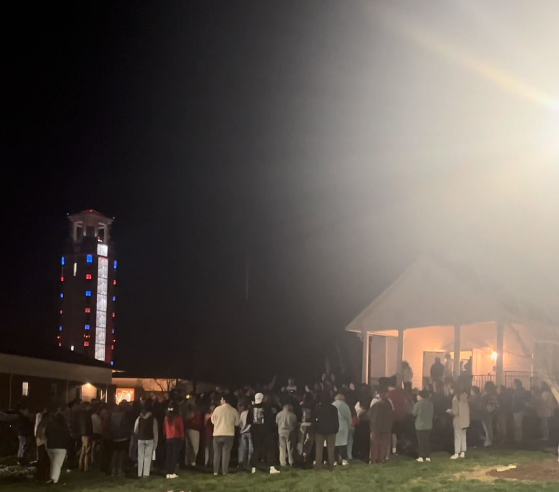 A line out the door and onto the grass outside of the prayer chapel