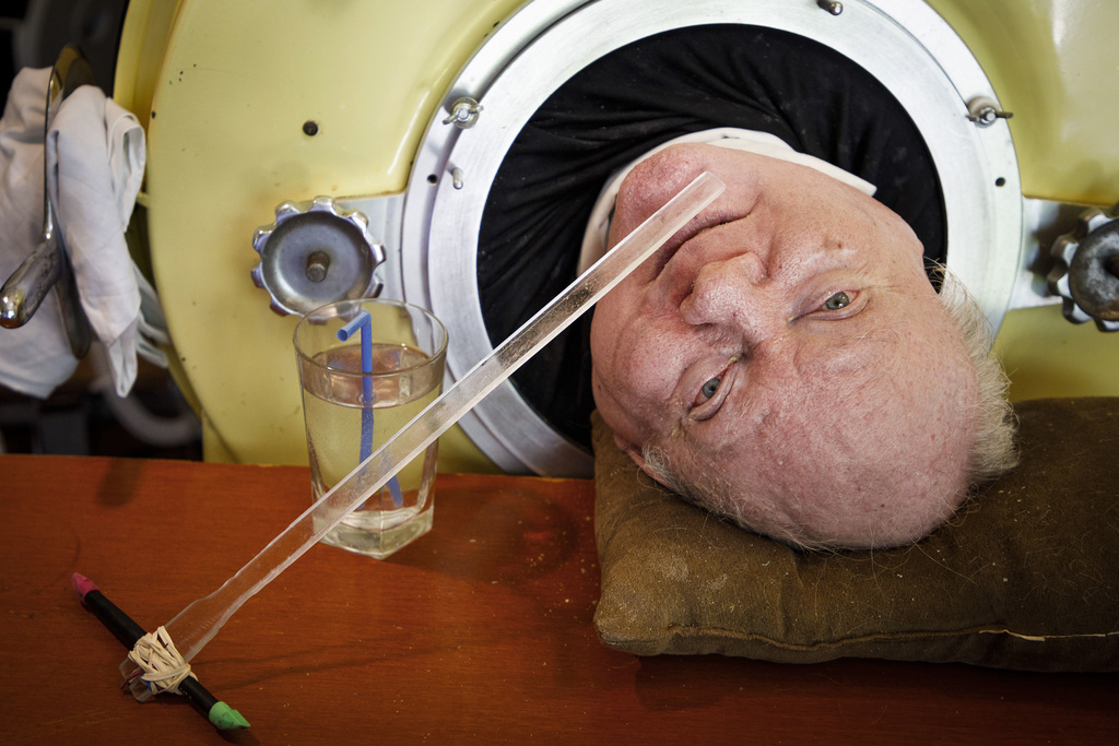 Paul Alexander looks out from inside his iron lung at his home in Dallas