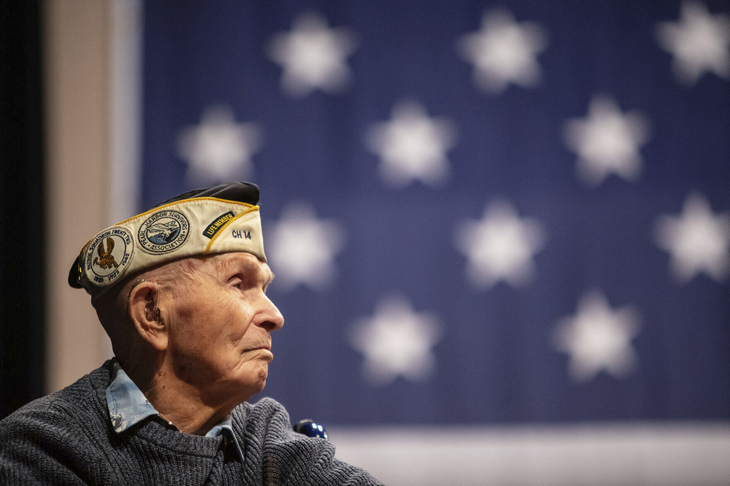 Pearl Harbor survivor Dick Higgins listens to a speaker during a ceremony at Bend High School in Bend, Ore., on Dec. 7, 2023,