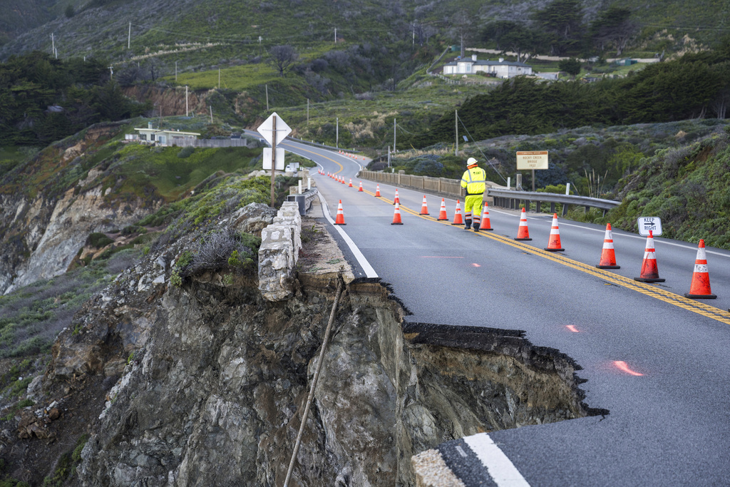 Cones mark a break in the southbound lane of Highway 1 at Rocky Creek Bridge in Big Sur, Calif.