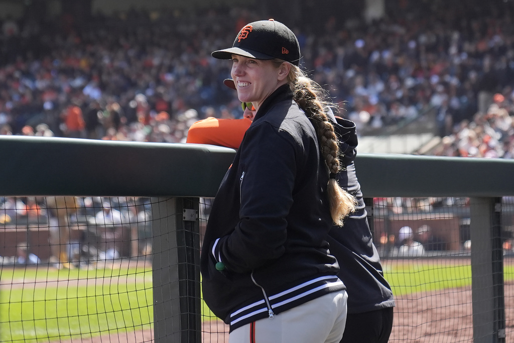 Not too long after visiting her baby, there was Nakken with hands in the pockets of her black Giants jacket, standing on the top step of the dugout with a big smile.