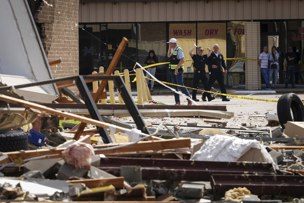 Authorities work at scene where tornado damaged several businesses Wednesday in Katy, Texas