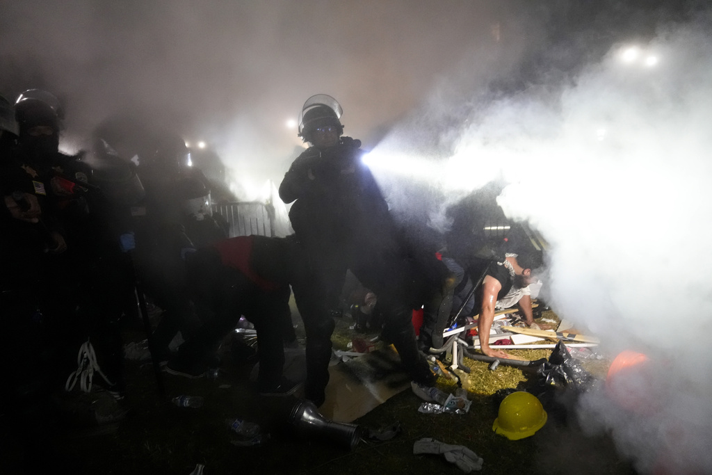 Police enter an encampment set up by pro-Palestinian demonstrators on the UCLA campus 