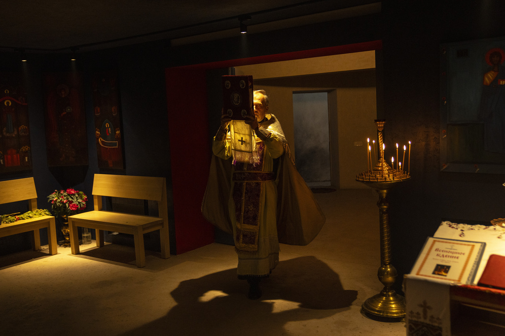 Christian Orthodox priest Hennadii Kharkivskyi leads a service at the chapel basement of the Church of the Intercession of the Blessed Virgin Mary in, Lypivka, near Lviv, Ukraine