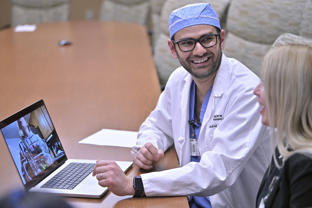 Dr. Rohaid Ali plays a video from a high school project made by his patient Alexis Bogan at Rhode Island Hospital in Providence, R.I. 