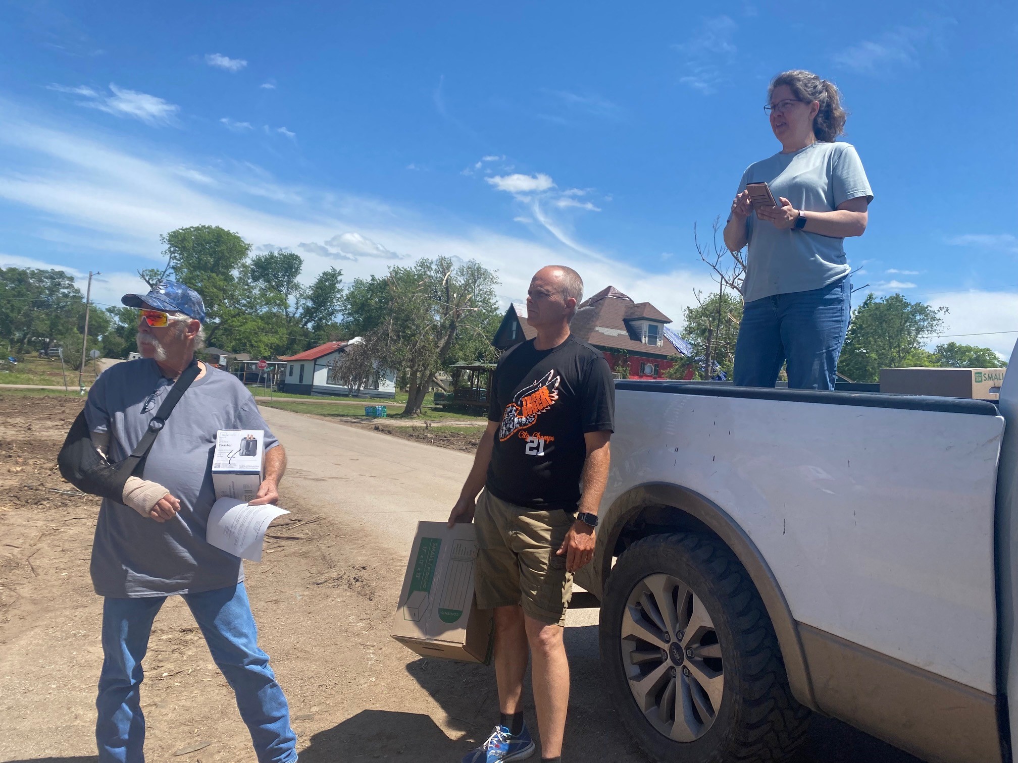 Sharing supplies with man injured in storm 