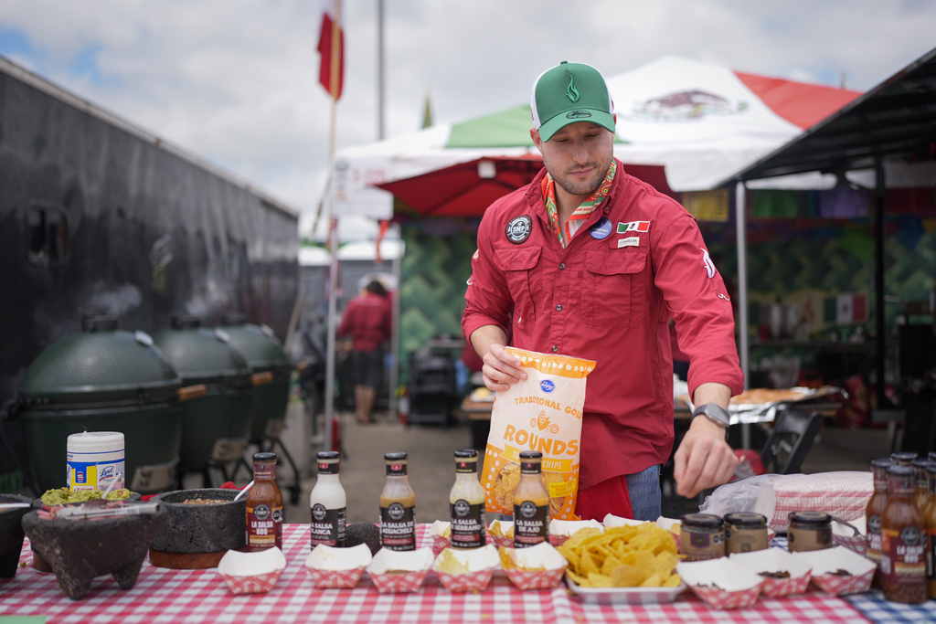 Juventino Alanis of the Sociedad Mexicano de Parrillieros team prepares food for tasting at the World Championship Barbecue Cooking Contest