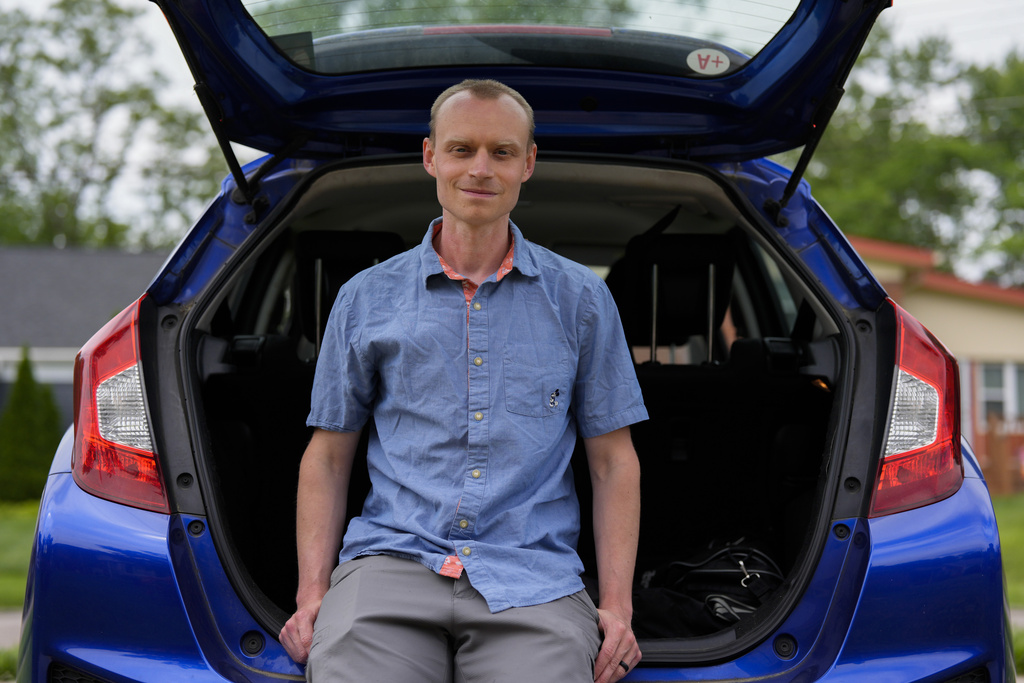 Caleb Jud, 33, with his Honda Fit in Cincinnati