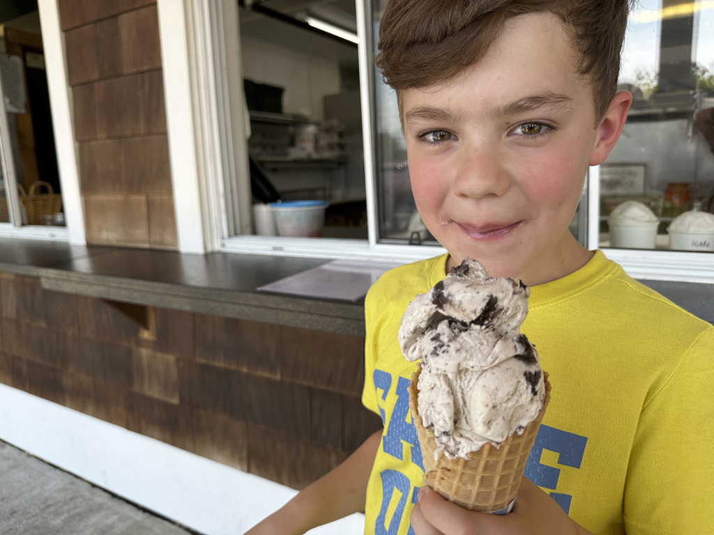 Silas Pociask, 9, of Deerfield, N.H., enjoys a "kiddie"-sized ice cream cone at Johnson