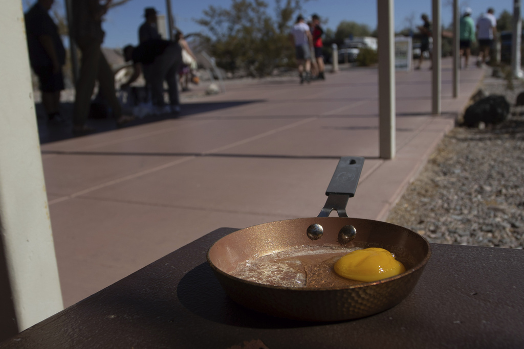 An egg lays in a small frying pan at the Furnace Creek Visitors Center in Death Valley National Park, Calif.