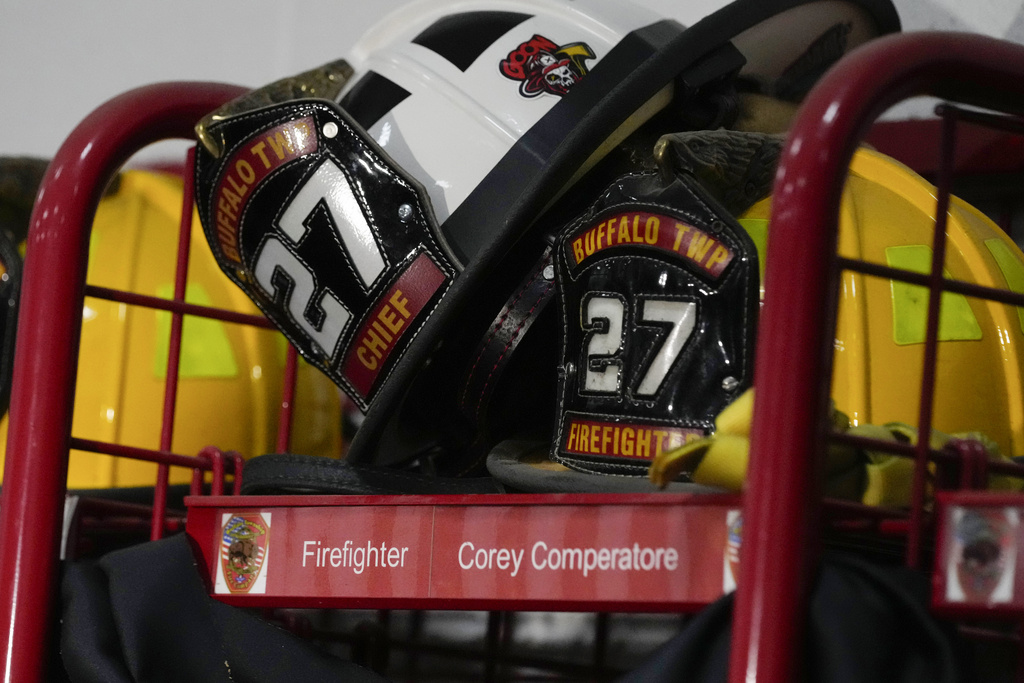 Helmets rest on the locker of firefighter Corey Comperatore at the Buffalo Township Fire Company 27 in Buffalo Township, Pa.