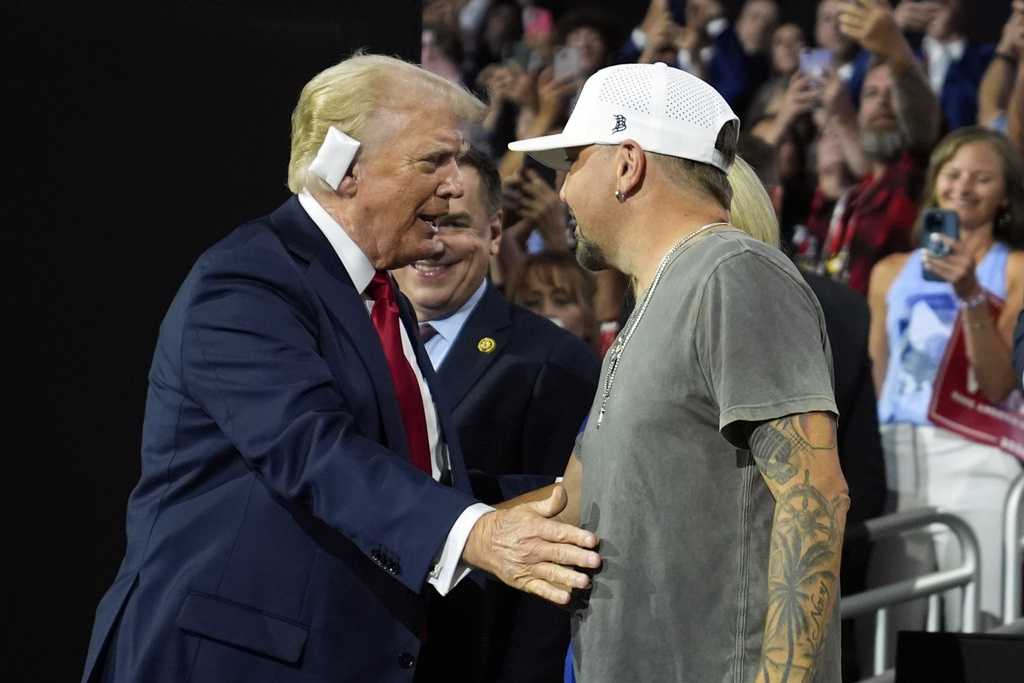 Republican presidential candidate former President Donald Trump greets country music singer Jason Aldean and his wife Brittany Kerr as he arrives for the final day of the Republican National Convention