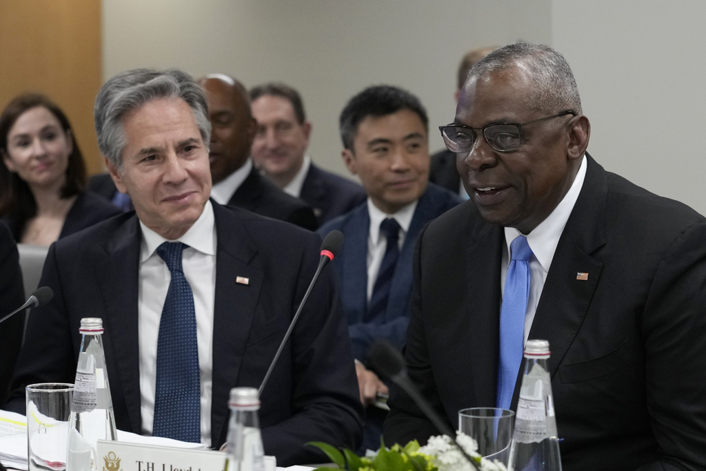 Defense Secretary Lloyd Austin, right, sitting next to Secretary of State Antony Blinken, left