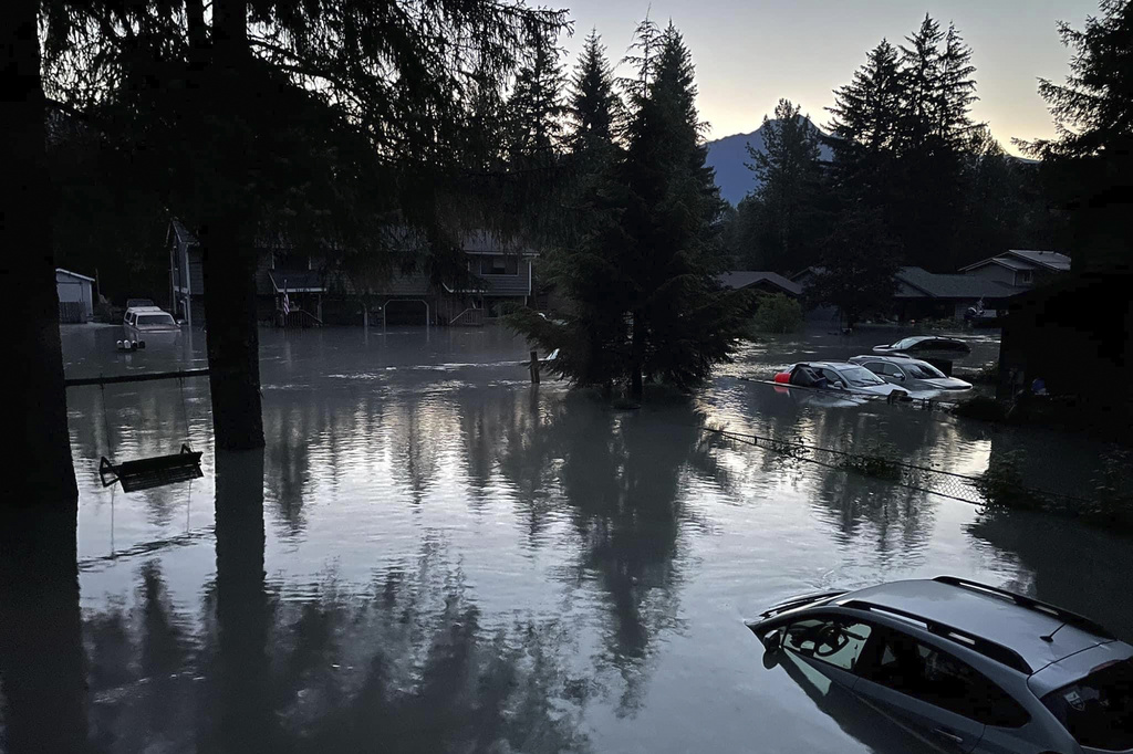 This image provided by the Alaska Department of Transportation and Public Facilities shows high water in a neighborhood in Juneau, Alaska, Tuesday, Aug. 6, 2024, following an outburst of flooding from a lake dammed by the Mendenhall Glacier.