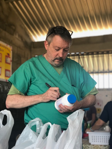 Dr. Cloy oversees treatments and Rxs on Honduras mission