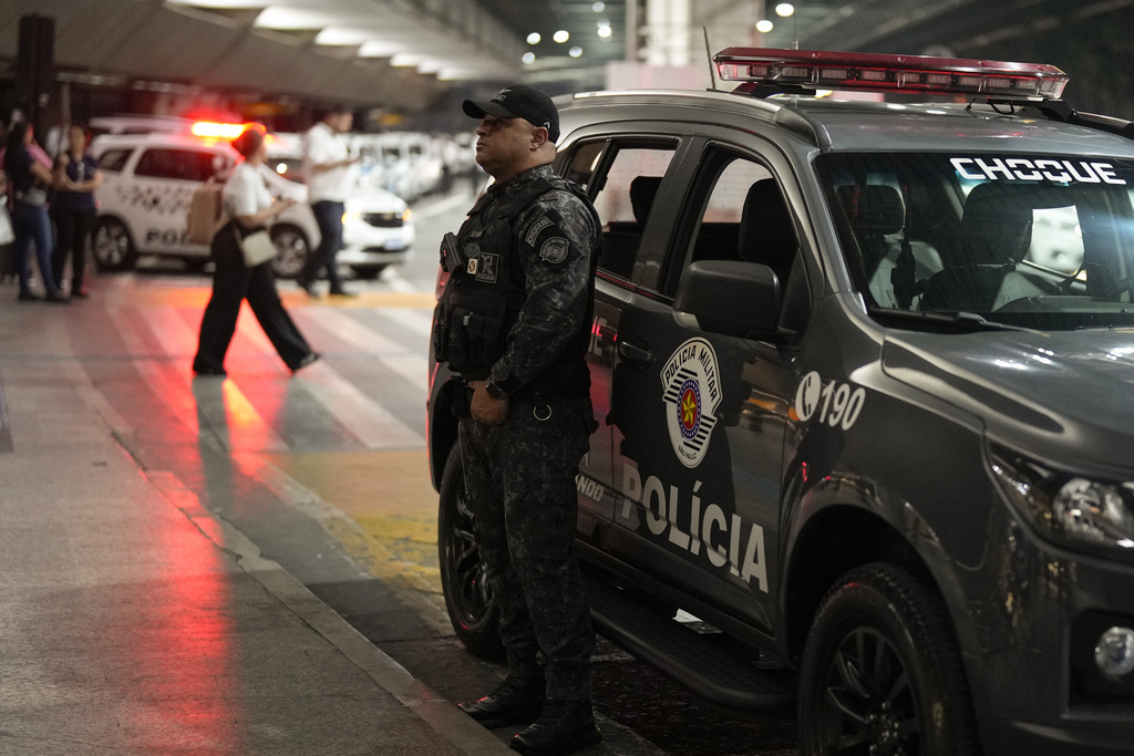 Policeman stands guard during the arrival of the Green Bay Packers at Sao Paulo International airport