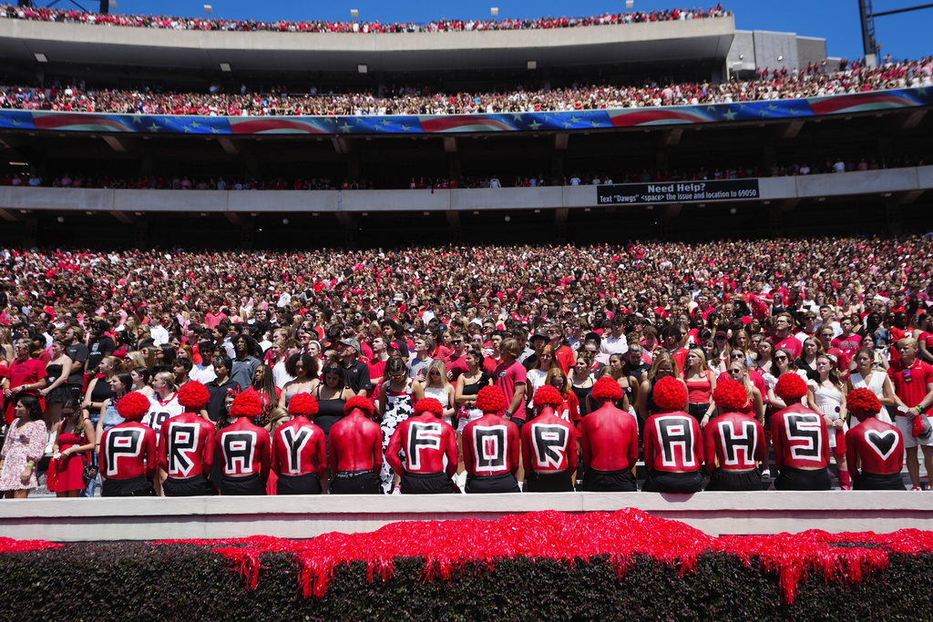 Fans observe a moment of silence for victims of Wednesday