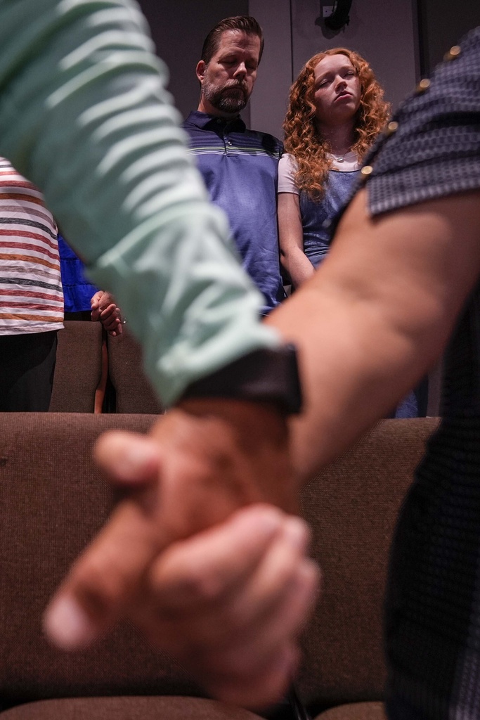 Church members pray during a Sunday service at Bethlehem Church in Bethlehem, Ga. 