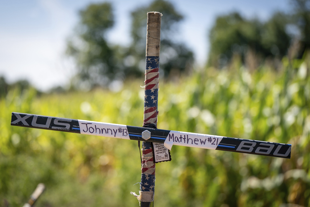 Memorial for Johnny and Matthew Gaudreau, who died last week when they were struck by a suspected drunken driver while riding bicycles, is shown in Salem County, N.J.