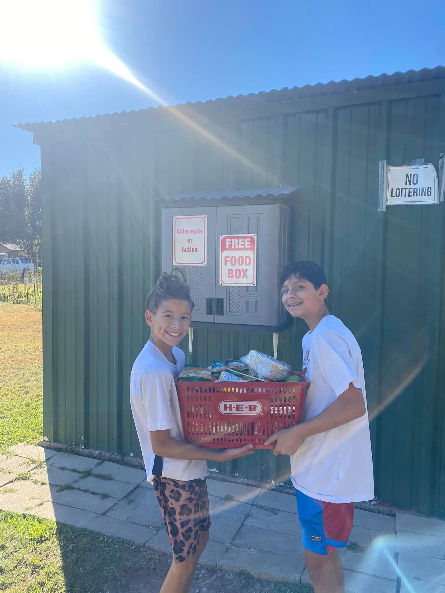 Sebastian and his friend replenishing their food pantry. 