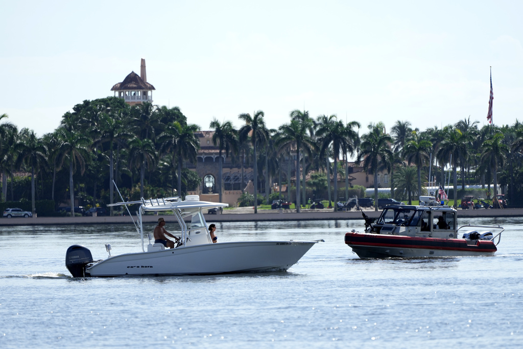 Law enforcement patrols in a boat outside of the Mar-a-Lago estate after the apparent assassination attempt 