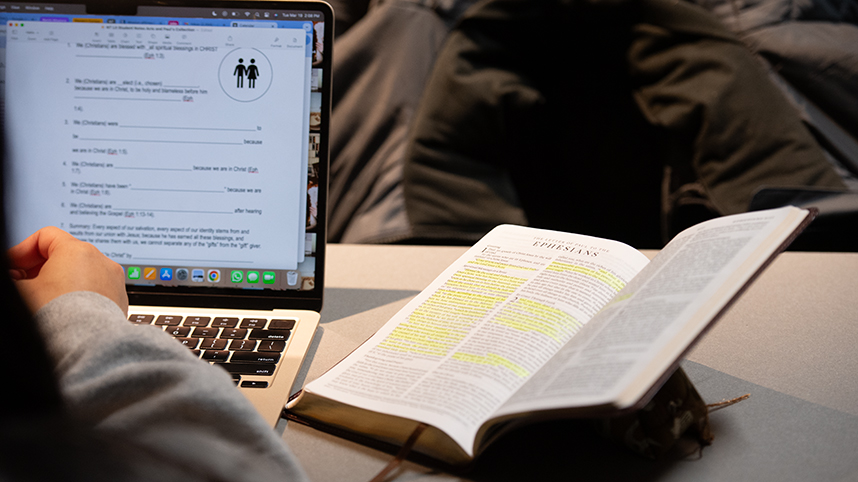 Students open their Bibles during a recent class