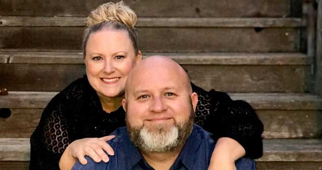 Pastor Joedy and his wife Kendra smiling for an official photo