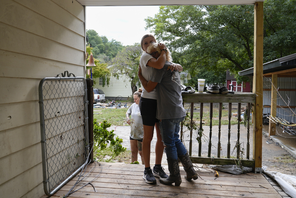 Ashlie Salliotte, left, hugs Janet Sams, right, at Sams