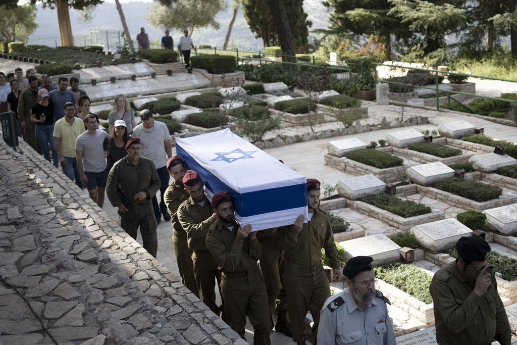 Soldiers carry the coffin of Israeli Army Capt. Eitan Yitzhak Oster, who was killed in action in Lebanon, during his funeral at Mt. Herzl military cemetery in Jerusalem