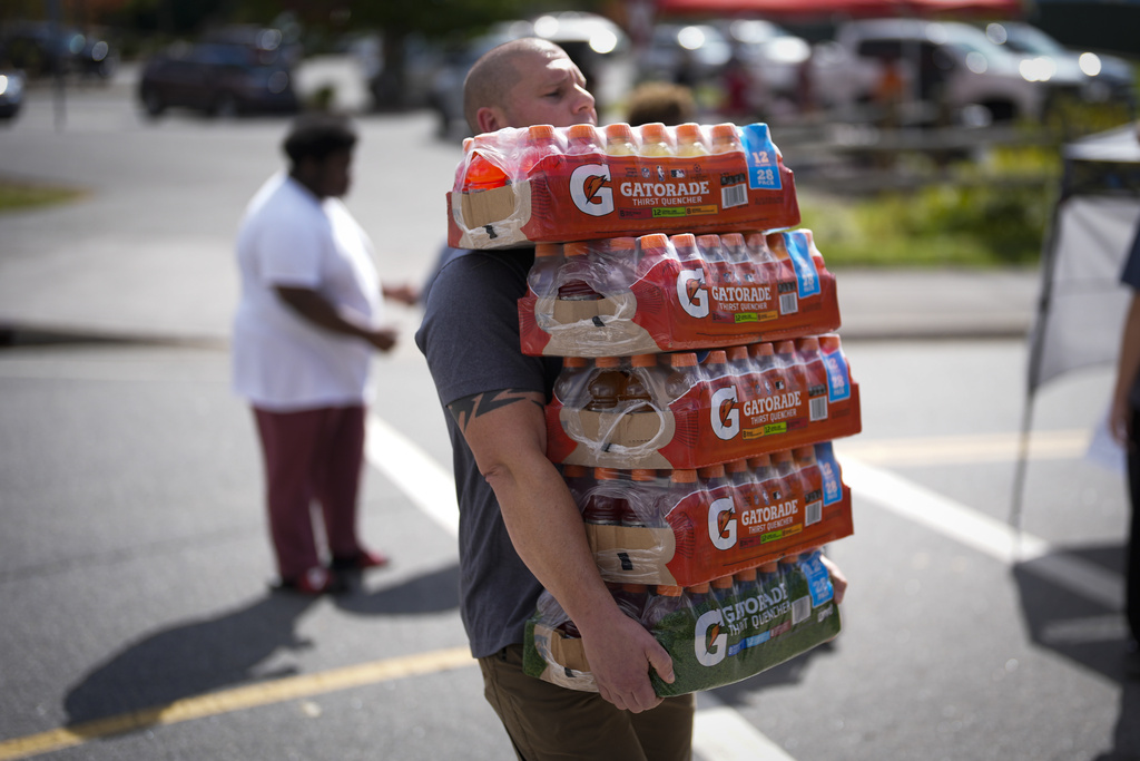 Derek Lisowski unloads supplies at Watauga High School in Boone, N.C.