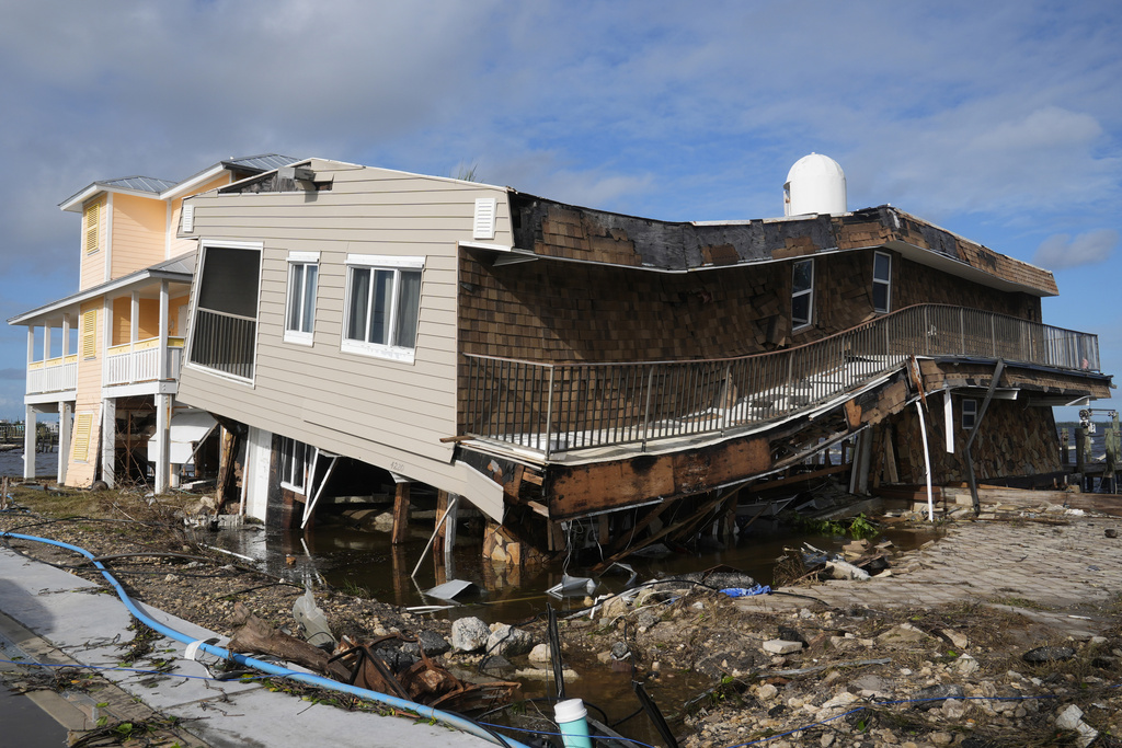 Houses lie in ruins after sustaining tornado and flood damage from Hurricane Milton in Matlacha, Fla. 