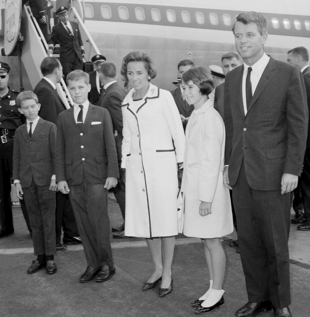 FILE - Attorney General Robert F. Kennedy, right, wife Ethel Kennedy, and children, from left, Bobby, Joseph, and Kathleen, second right, pose at Kennedy International Airport in New York, July 1, 1964, shortly after they returned from a one-week trip to West Germany and Poland. 