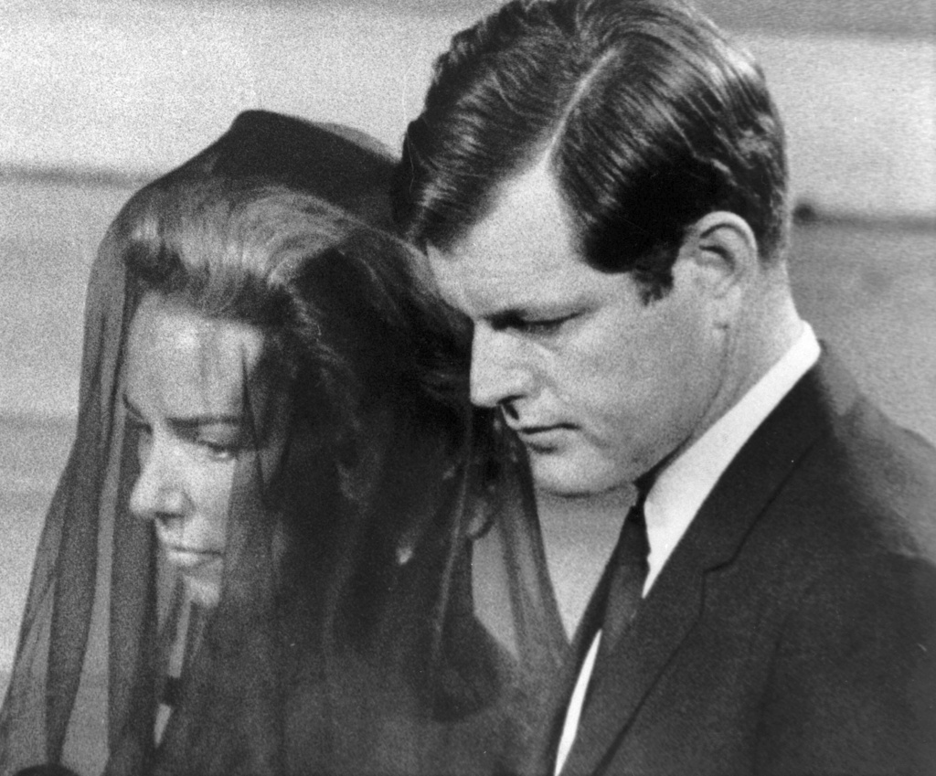 FILE - Mrs. Ethel Kennedy is escorted by her brother-in-law, Senator Edward Kennedy, to their pew in St. Patrick