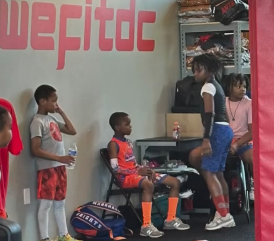 Several young kids at the gym