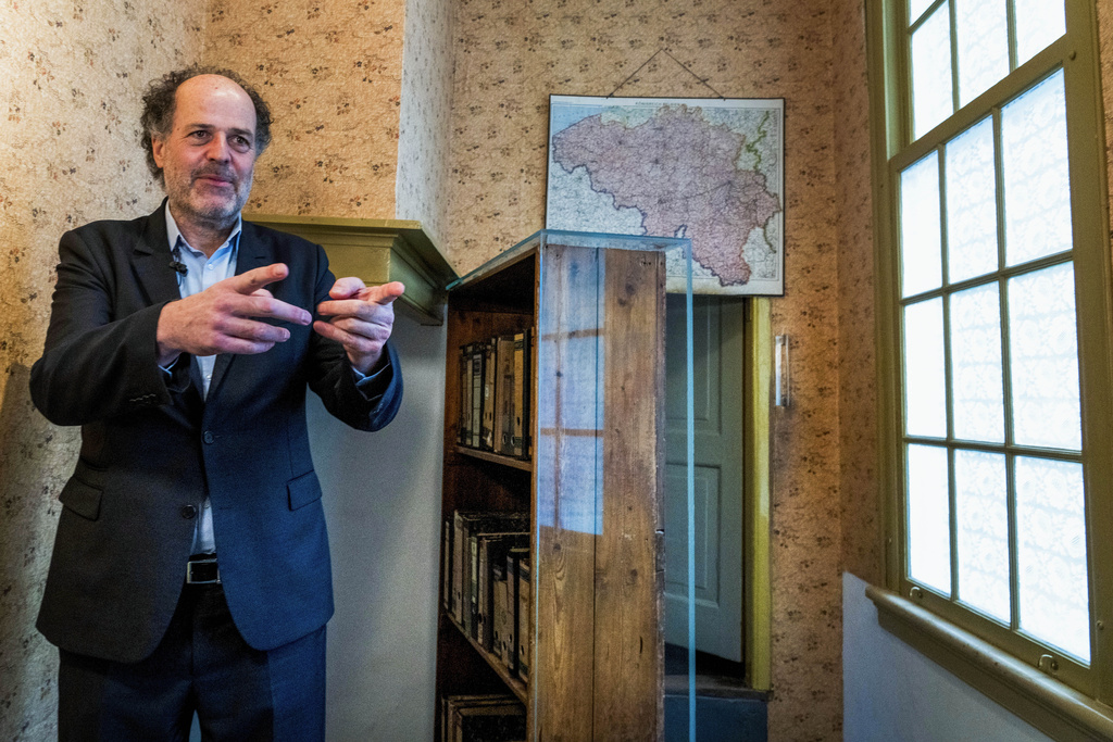  Ronald Leopold, executive director of the Anne Frank House, gestures as he talks next to the passage to the secret annex 