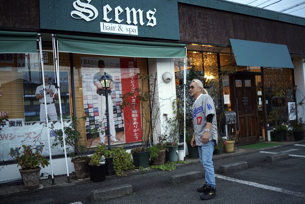 Hironobu Kanno, representative of a private fan club of Shohei Ohtani of the Los Angeles Dodgers, speaks at his beauty salon in Oshu, northeastern Japan, the hometown of Ohtani, Tuesday, Oct. 29, 2024.