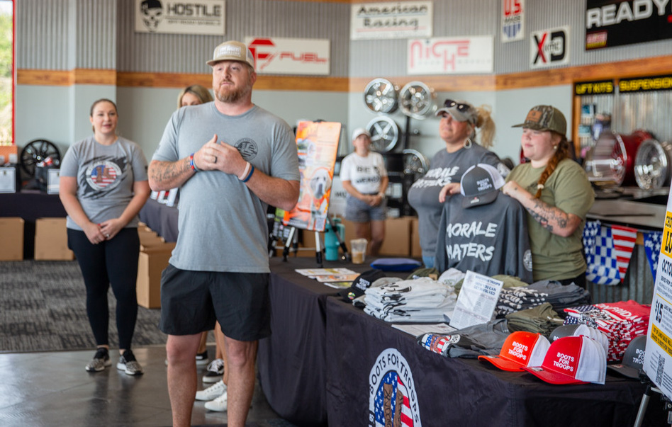 Man with volunteers around him