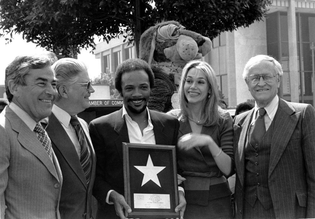 Musician Quincy Jones and his wife, actress Peggy Lipton, hold Jones