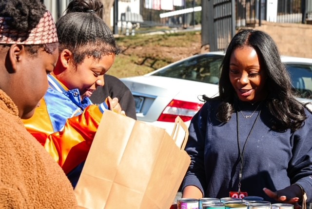 Three women with groceries